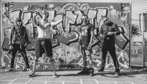 An image of Alive at Midnight band members.
