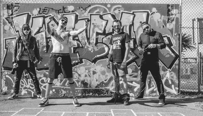 An image of Alive at Midnight band members.